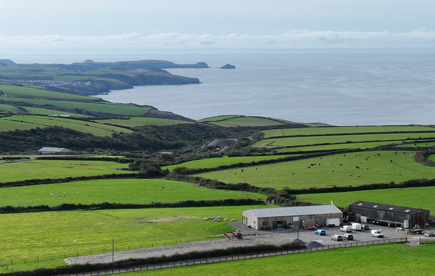 a view of the countryside with a sea view from sea view farm shop in cornwall